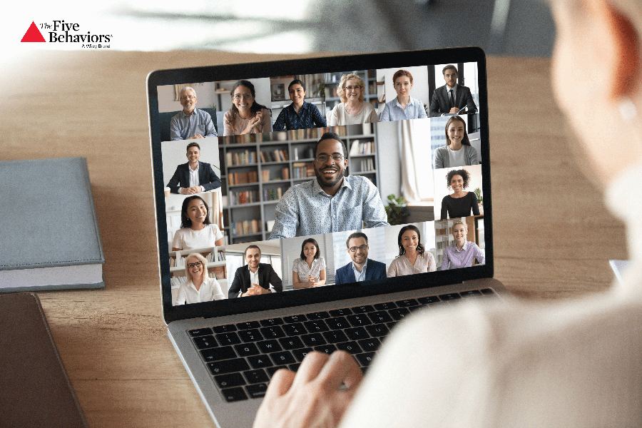 A person joining a video call with several colleagues