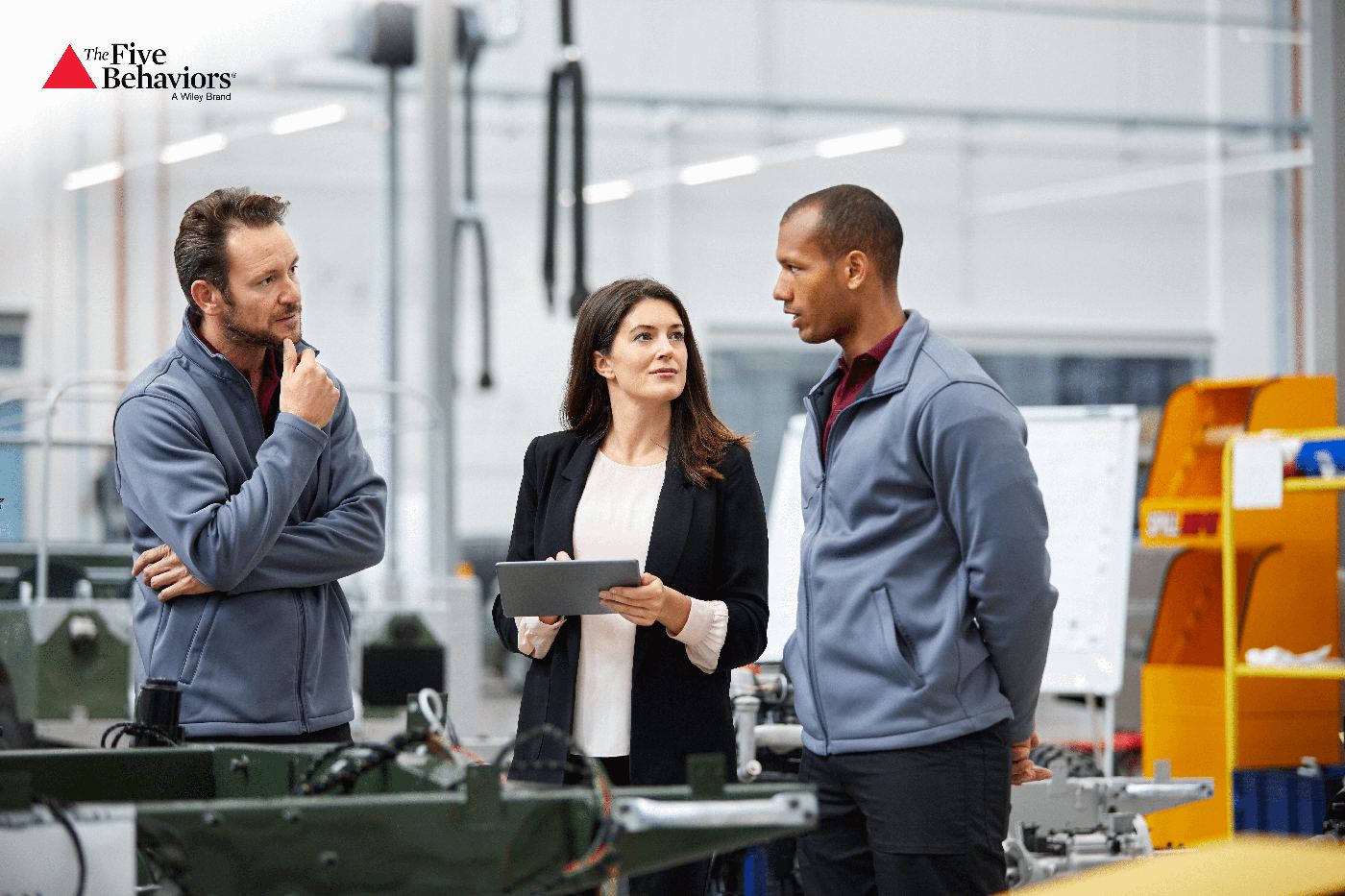 A team discussing a problem together in a workshop setting