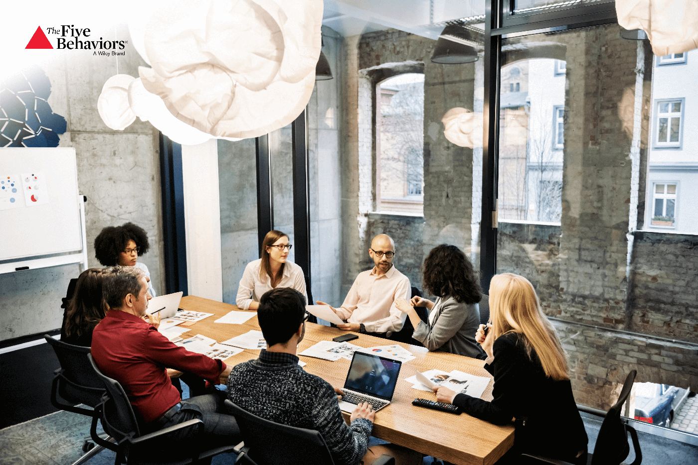 A team of colleagues in discussion around a table