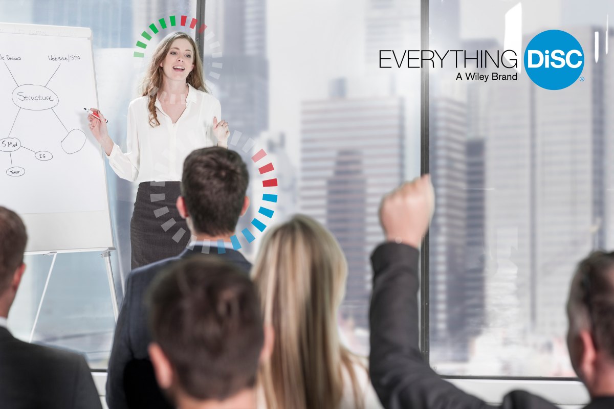 A certified Everything DiSC practitioner facilitating a session with a group